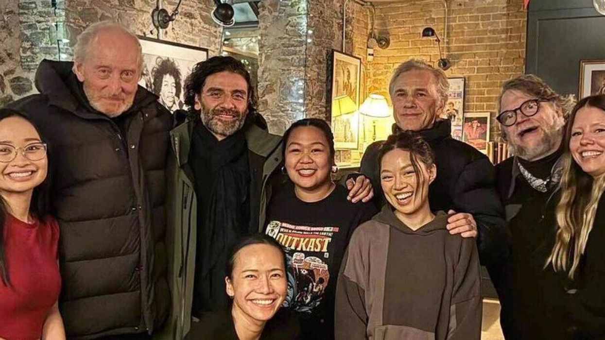 A group of people smiling for a photo.