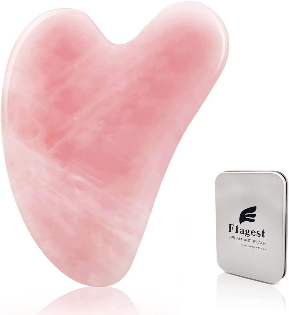 A Gua Sha Rose Quartz Massage Tool.