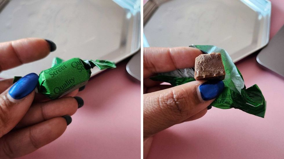 A hand with blue nails holding a chocolate in a green wrapper. Right: A hand with blue nails holding a chocolate with a bite taken out of it.