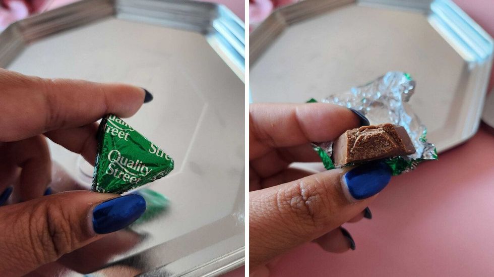 A hand with blue nails holding a chocolate in a green wrapper. Right: A hand with blue nails holding a chocolate with a bite taken out of it.