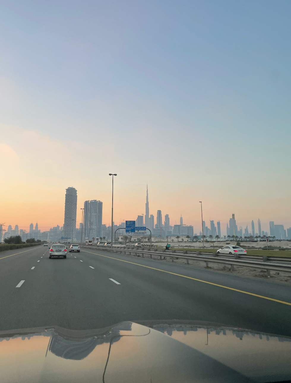 A highway in Dubai with a view of the skyline.