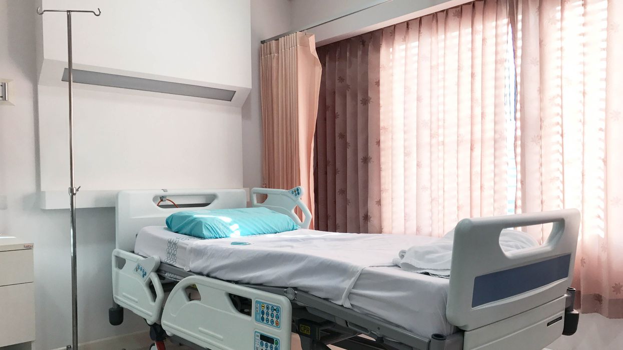A hospital bed in a hospital room.