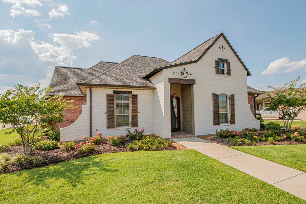 A house with a green lawn.