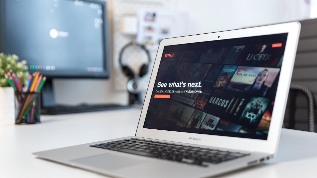 A laptop showing the Netflix home screen.