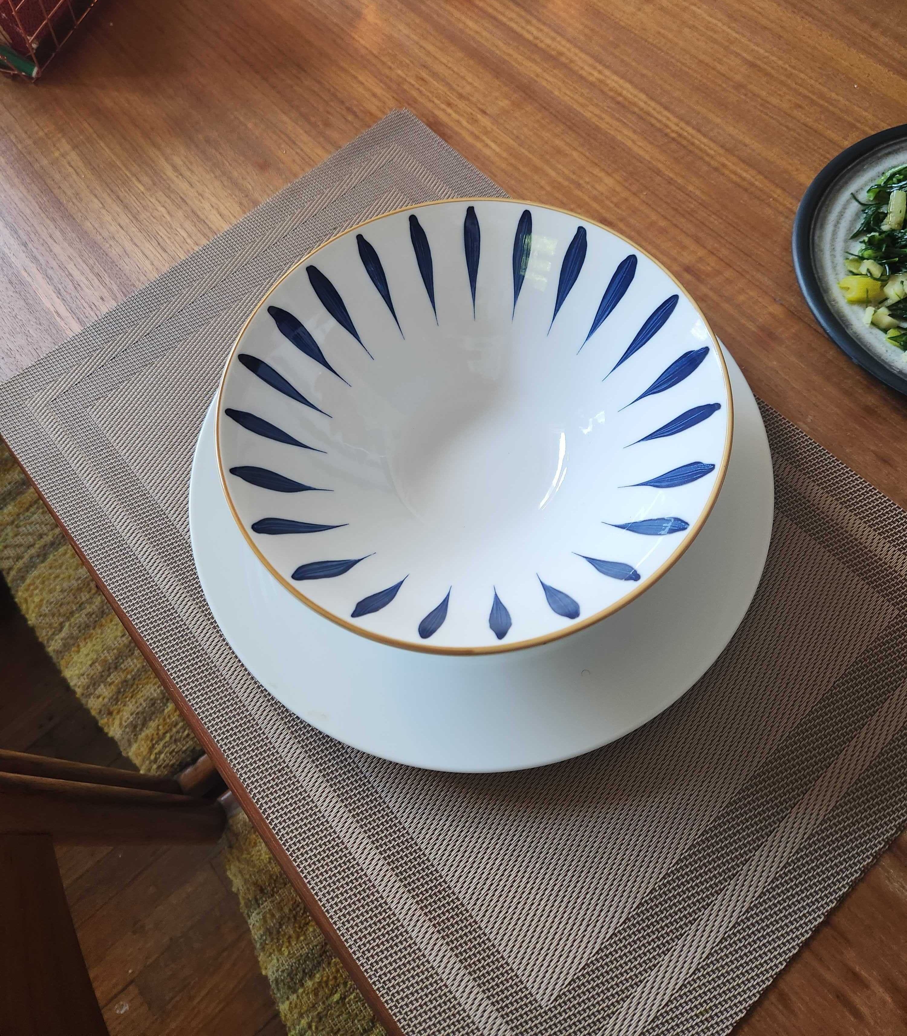 A large bowl, plate and placemats from Dollarama.
