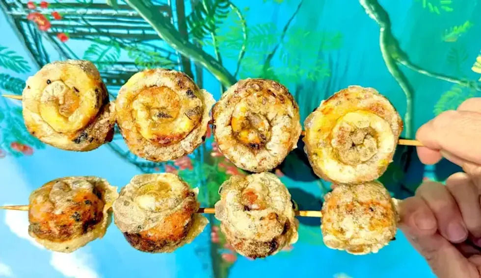 A lobster roll on a stick