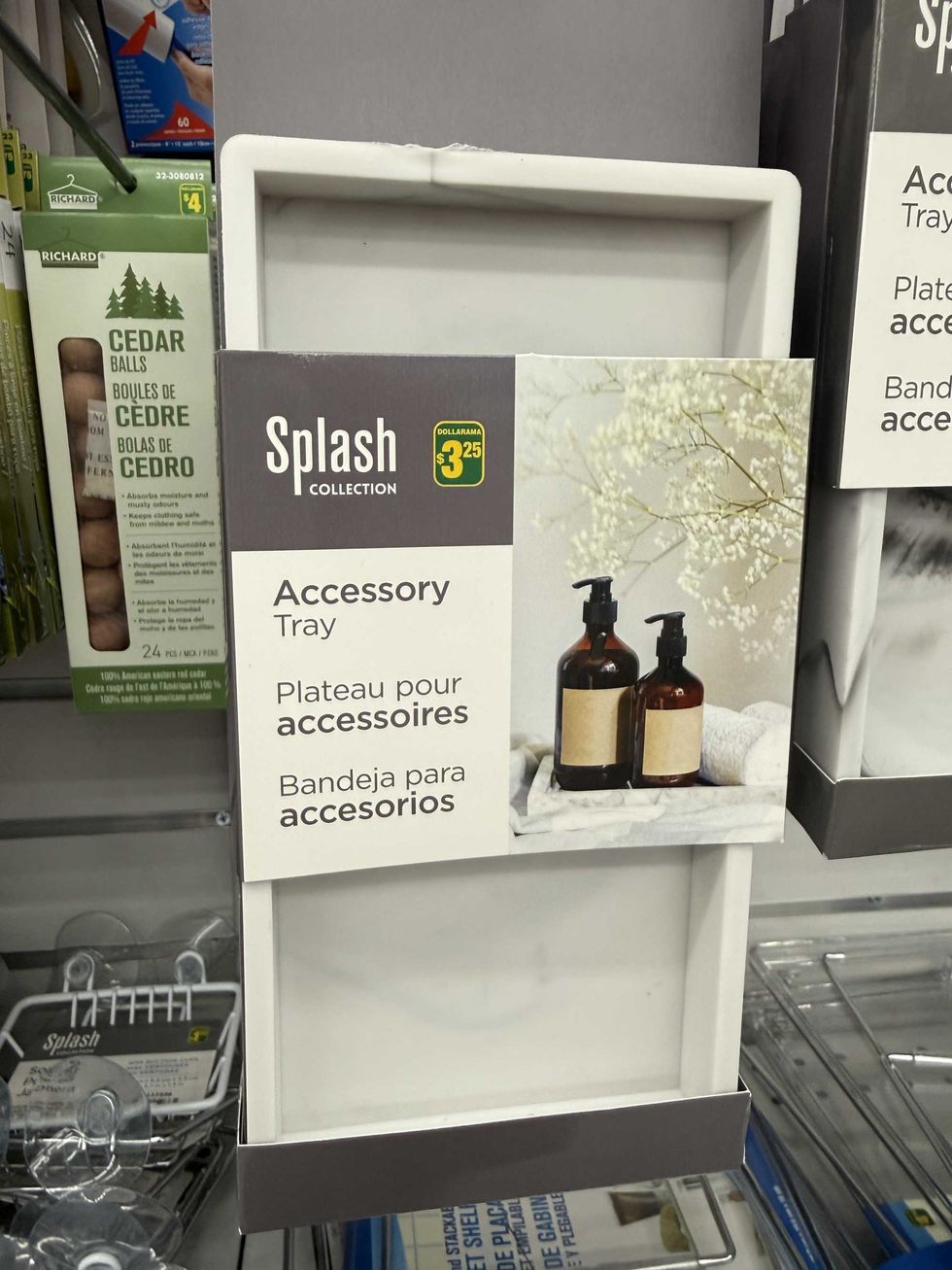 A long rectangular item that has a picture of soap bottles sitting on top of it and a label reading accessory tray.