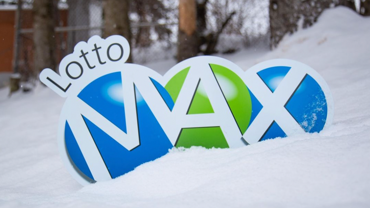 A Lotto Max sign in the snow.