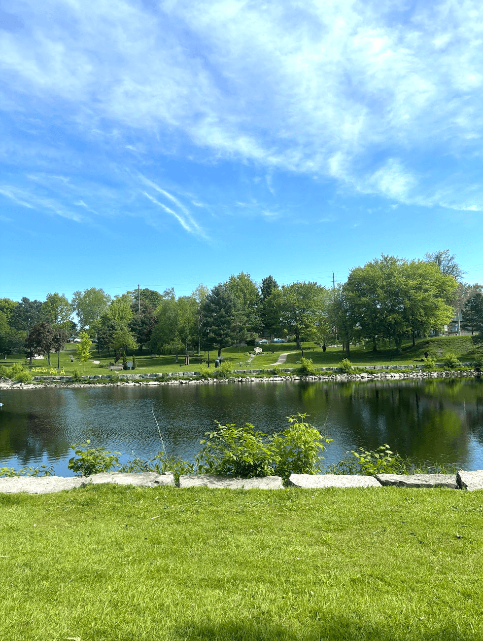 A lush riverside view in Gananoque.