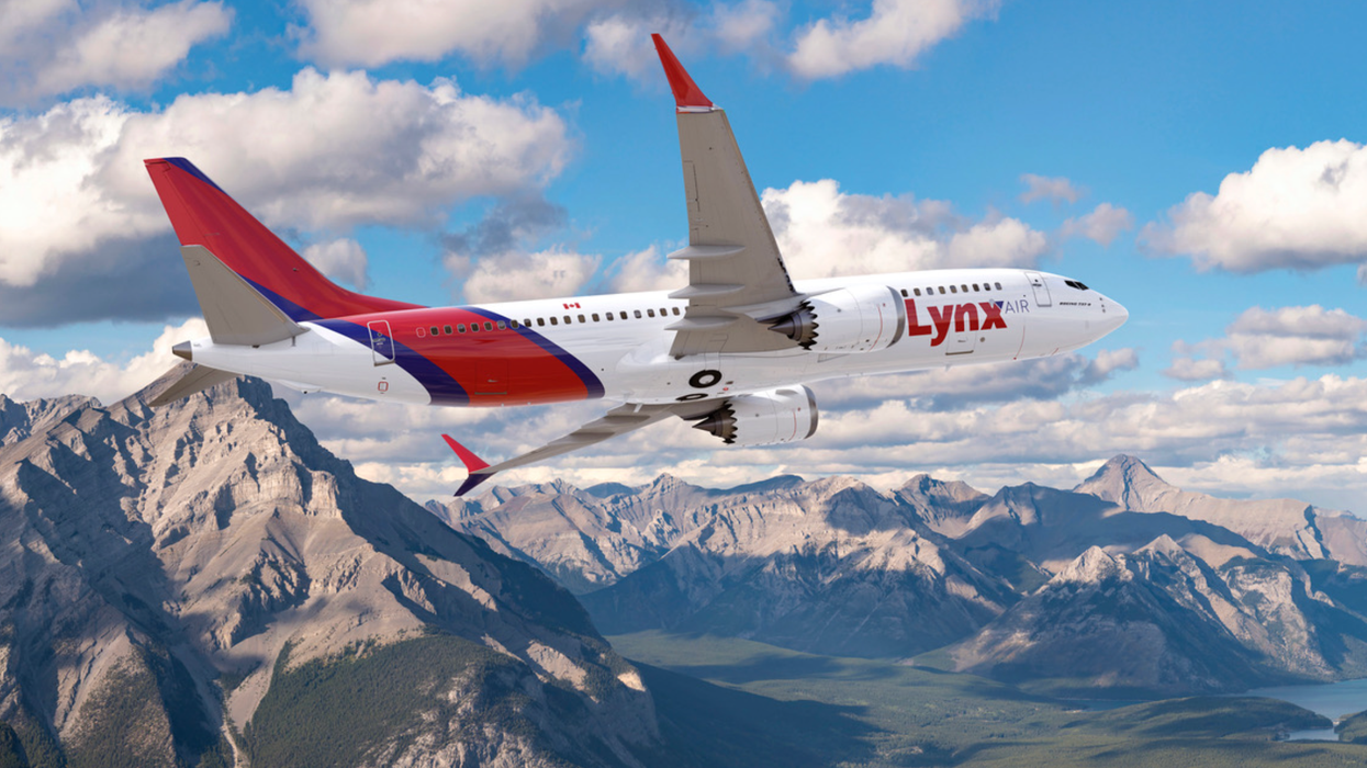 A Lynx Air plane in the sky.