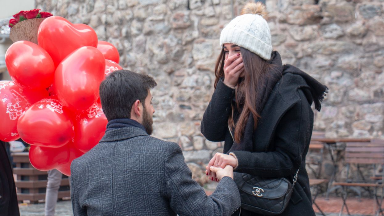 A man proposing to his girlfriend.