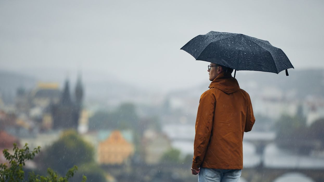 A man standing in the rain.