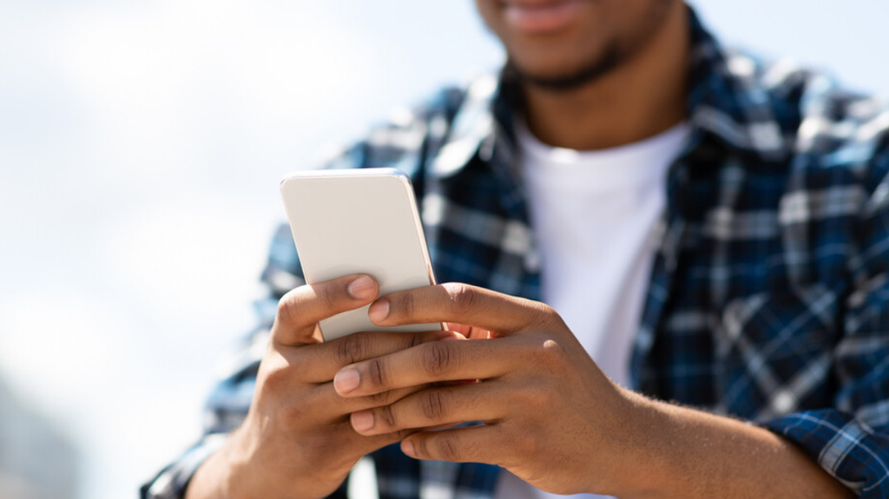 A man texting on his phone.