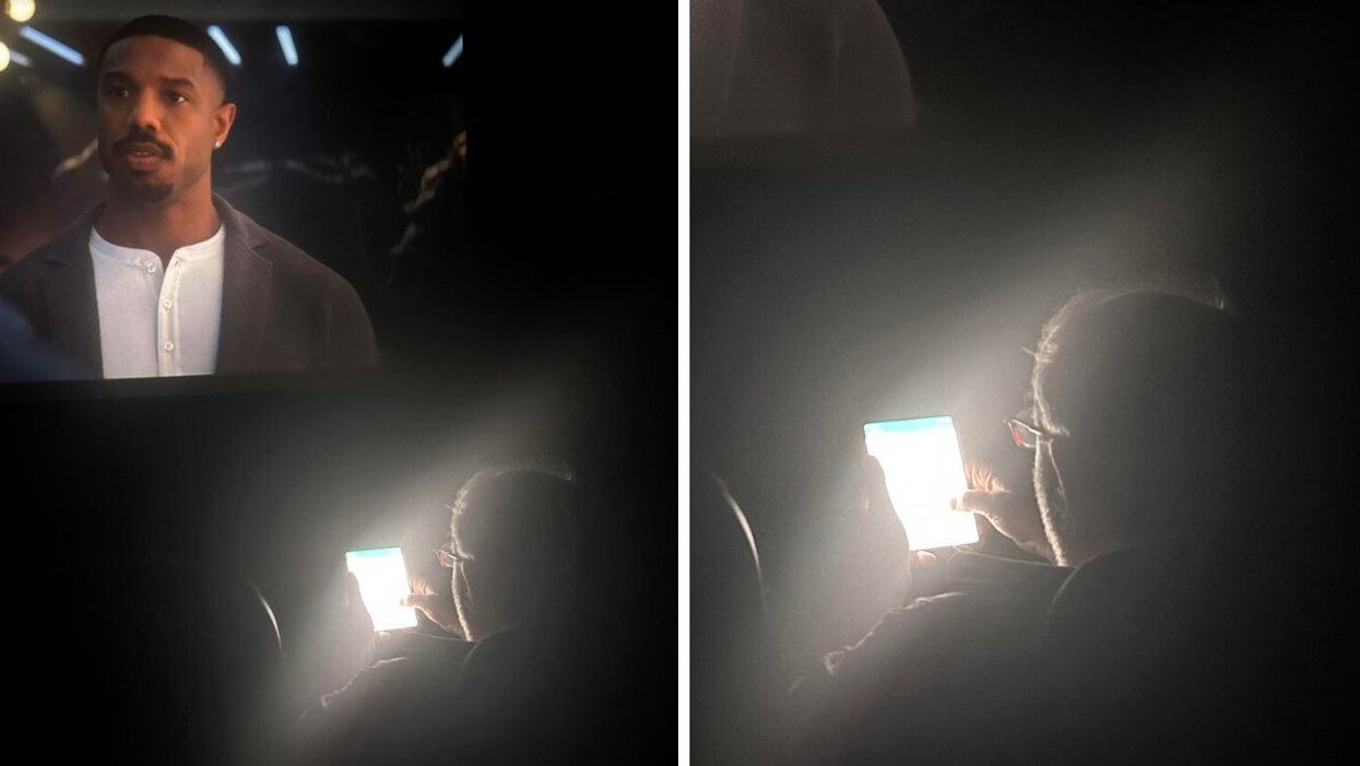 A man using his phone on full brightness in the cinema.