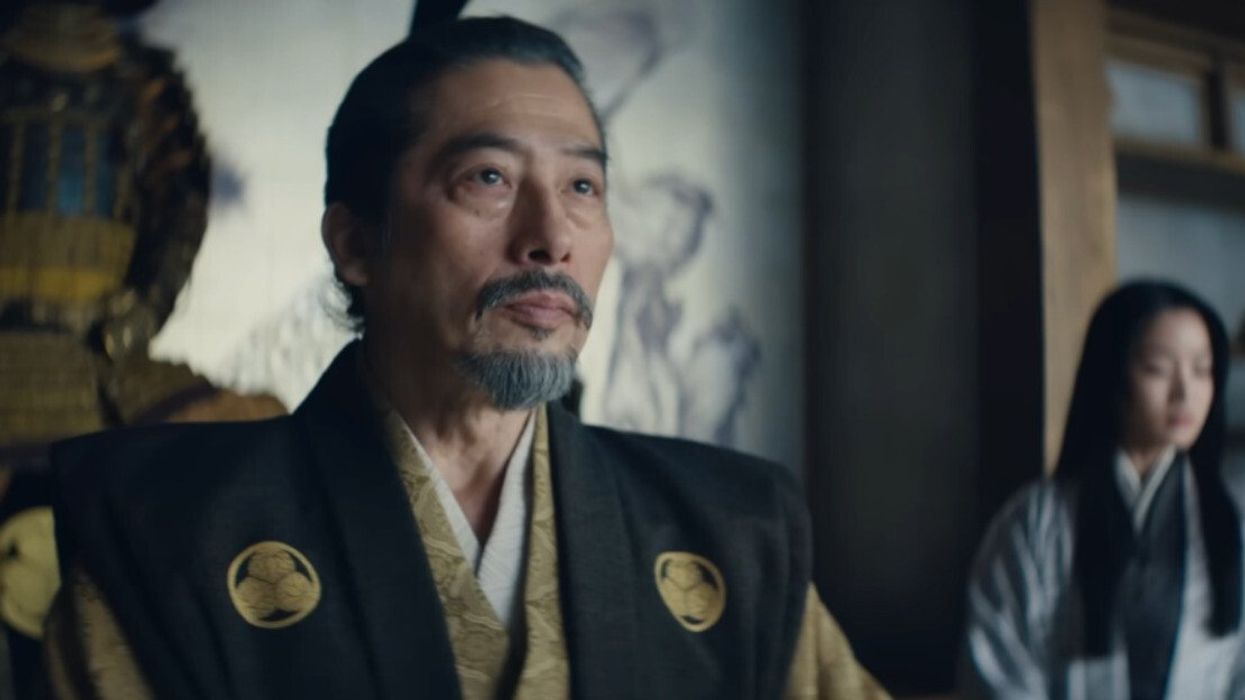 A man with a serious expression on his face looking off camera during a scene in Shogun.