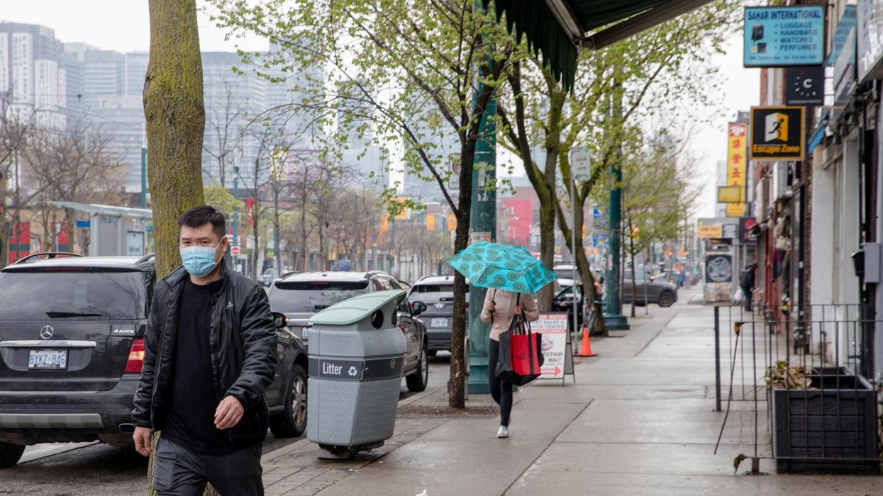 A masked individual in Toronto.
