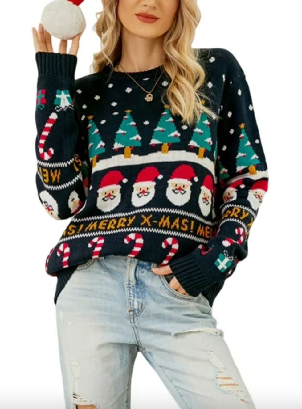 A model wearing a sweater with Christmas trees, Santa and candy canes.