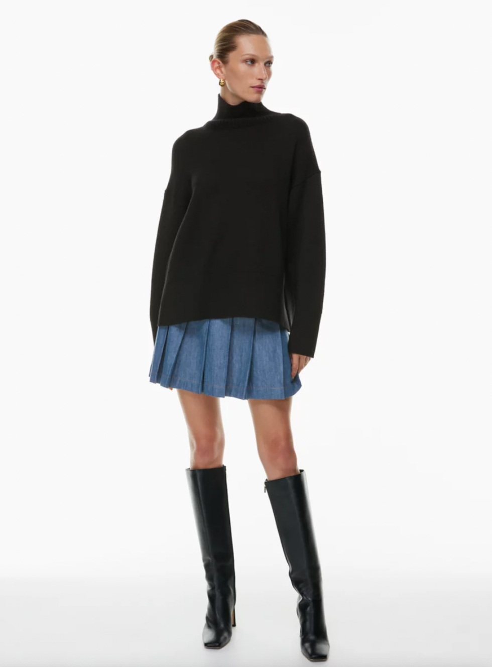 A model wearing Aritzia's Perspective Jean Skirt.