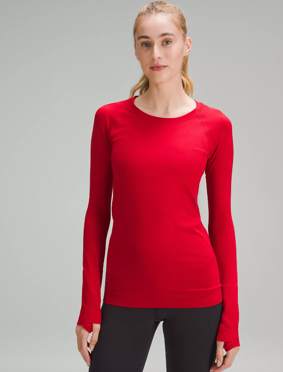 A model wearing Lululemon's Swiftly Tech Long Sleeve Shirt 2.0.