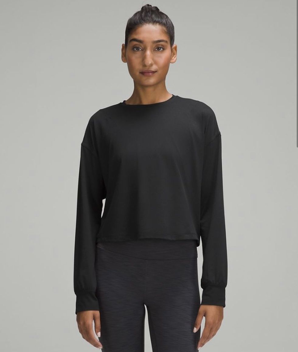 A model wearing the Abrasion-Resistant High-Coverage Long-Sleeve Shirt in the colour Black.