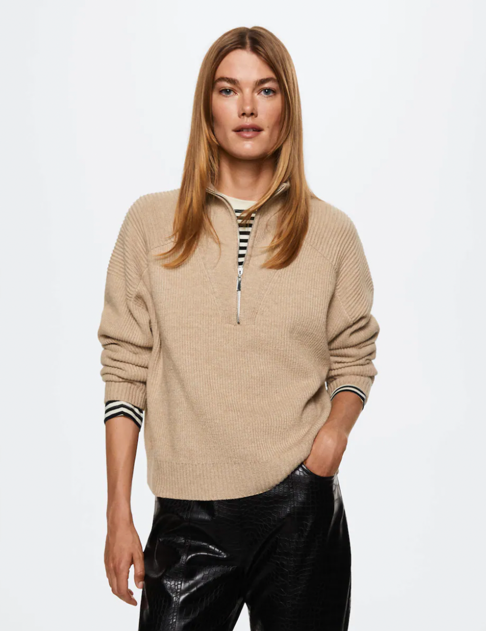 A model wearing the High neck sweater with zip from Mango.