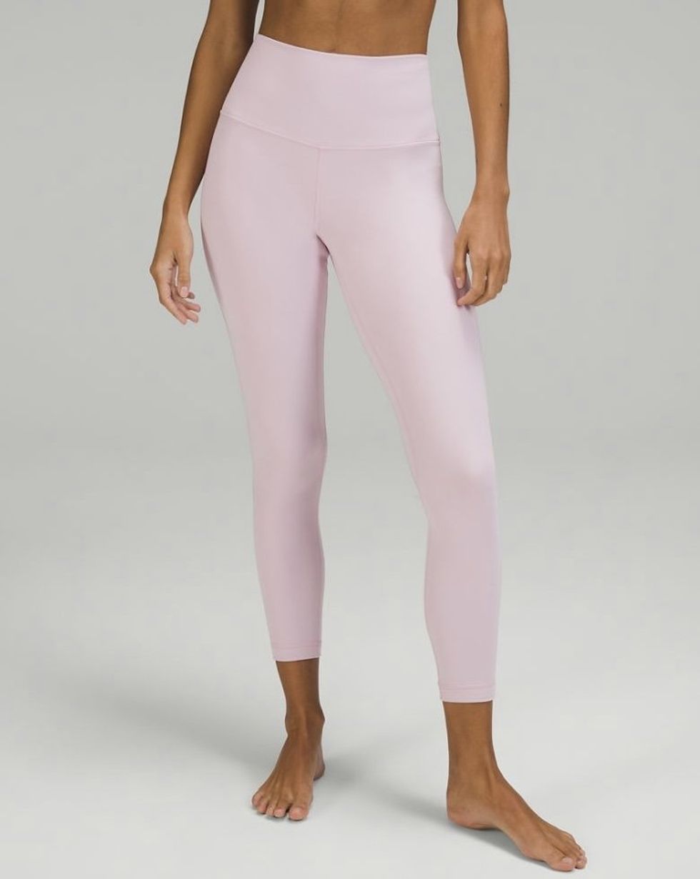 A model wearing the Lululemon Align High-Rise Pant 25" in the colour Pink Peony.
