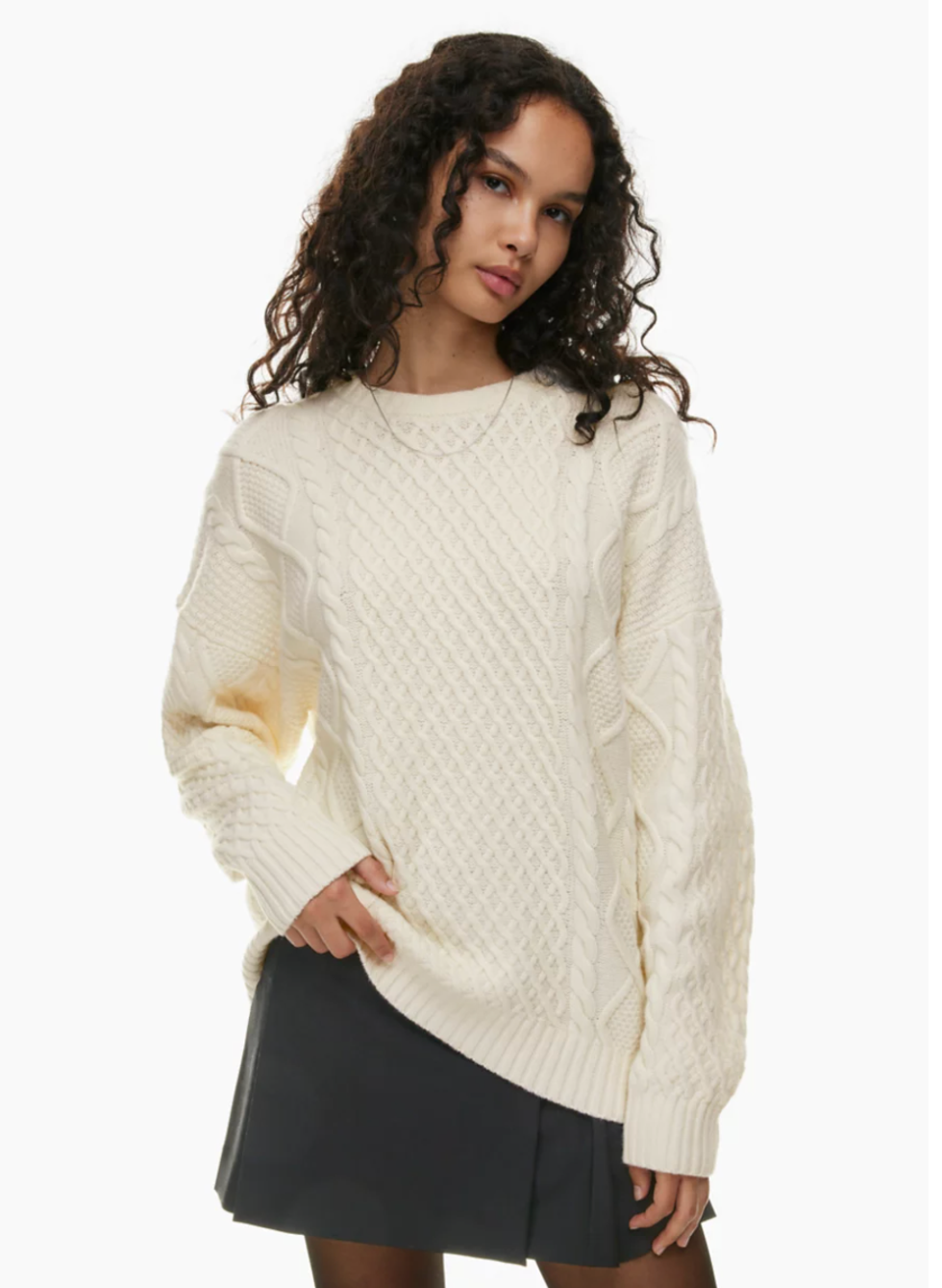 A model wearing the Peggy Sweater.