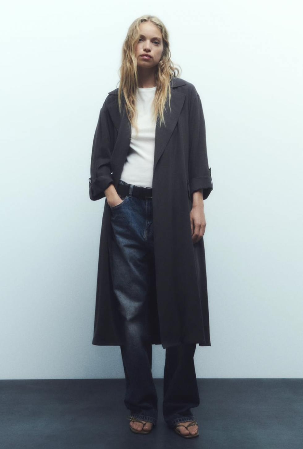 A model wearing Zara's Long Fluid Trench Coat.