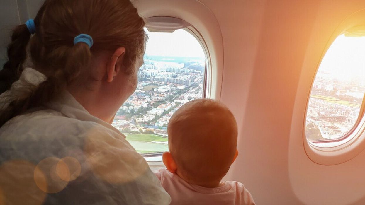 A mom and her baby on a plane.