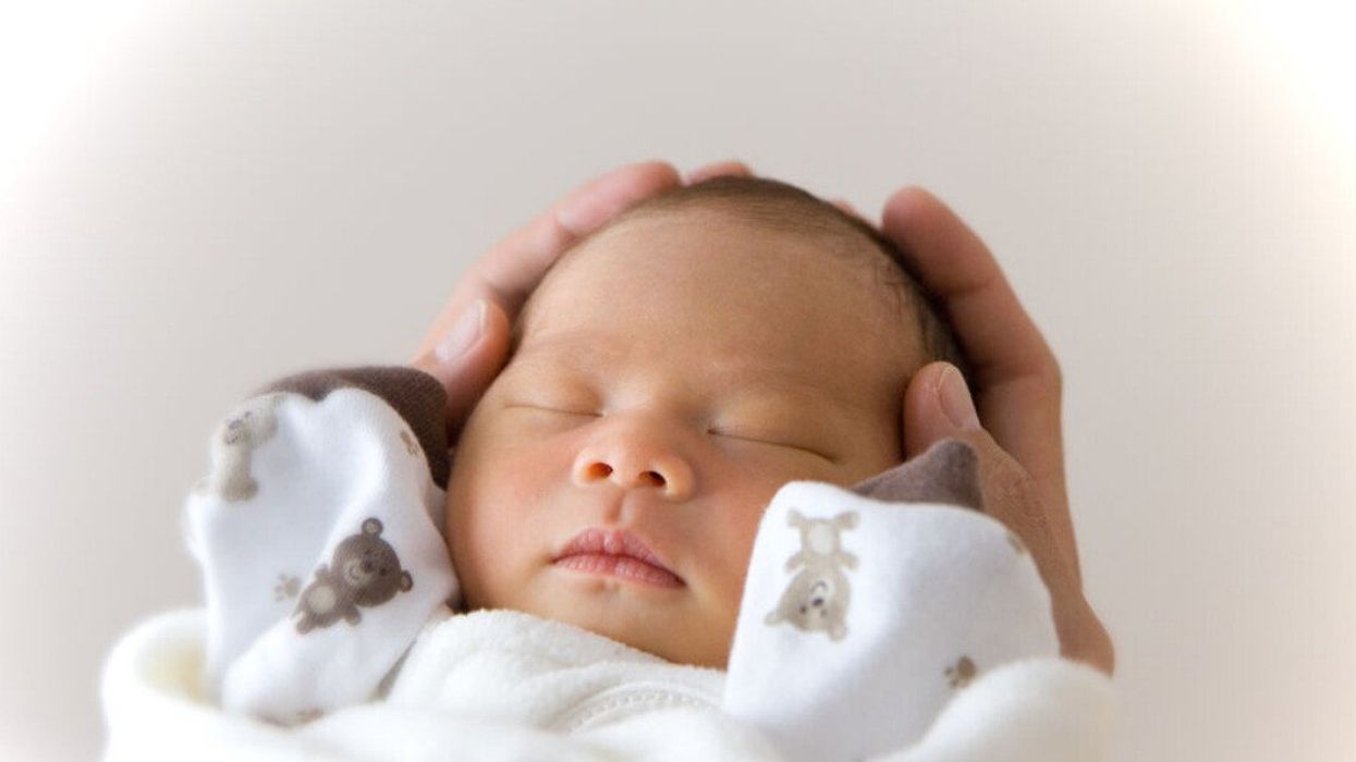 A newborn baby sleeping.