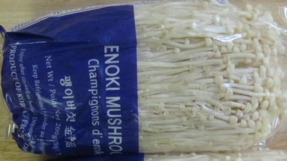 A package of Enoki Mushrooms.