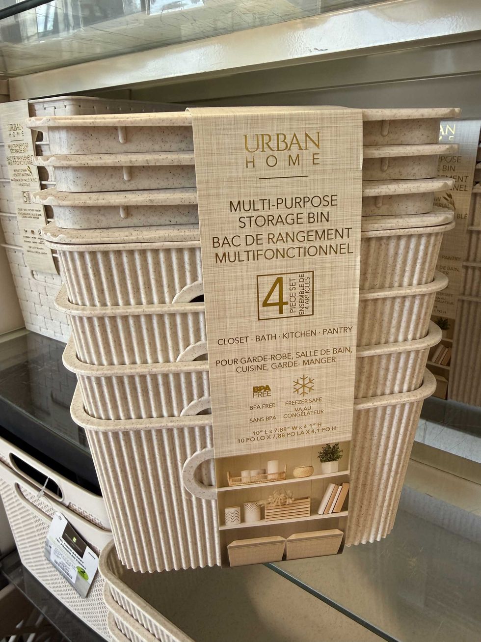 A package of four multi-purpose storage bins on a store shelf.