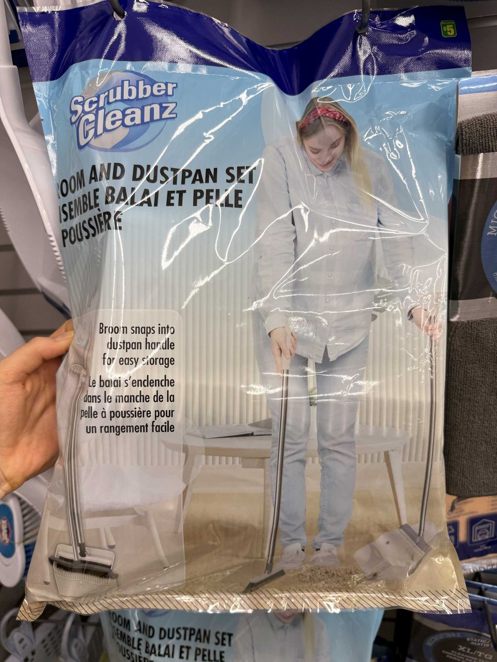 A package with a picture of a woman using a broom and dustpan.