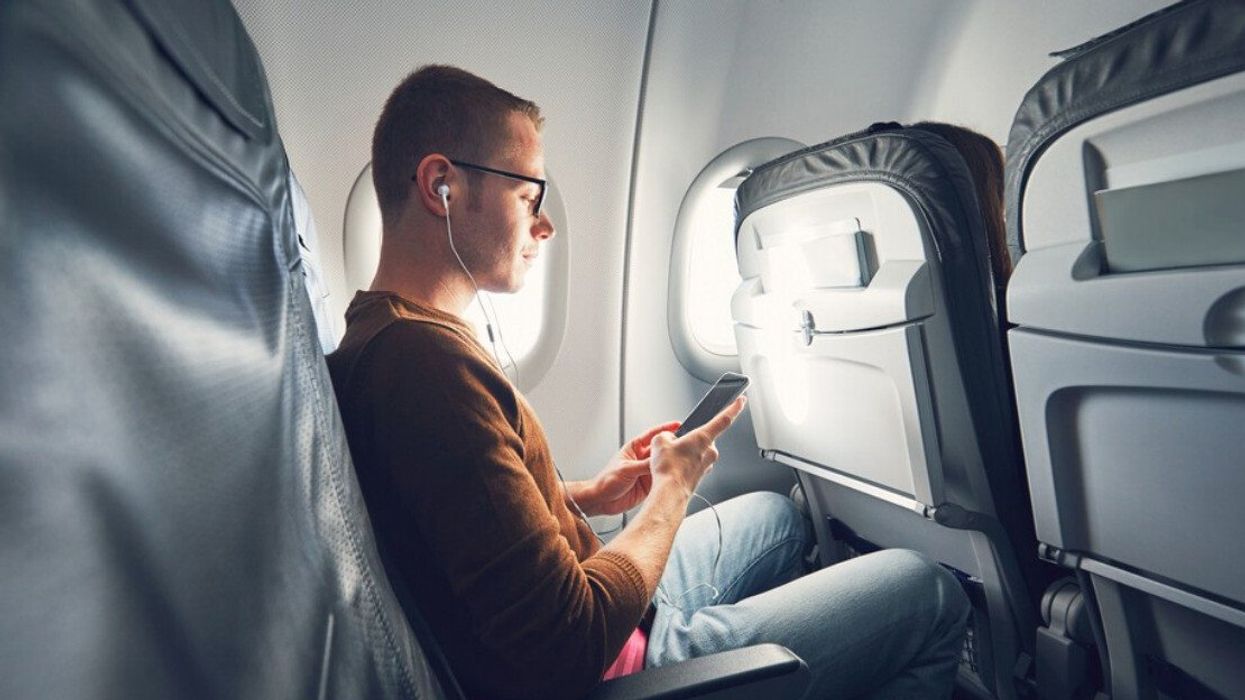 A passenger on an airplane.