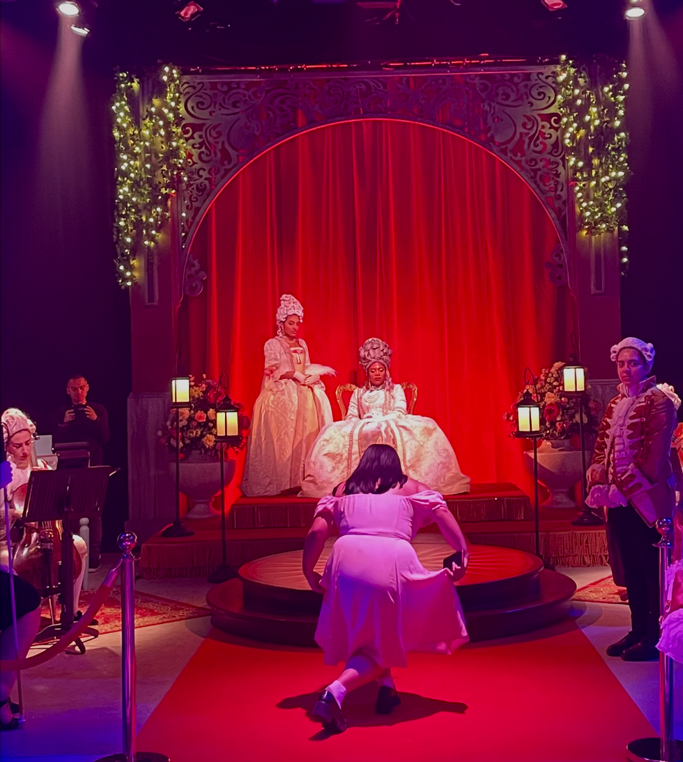 A person bows to the queen.