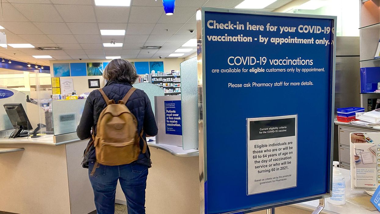 A person checks in for their COVID-19 vaccination appointment.