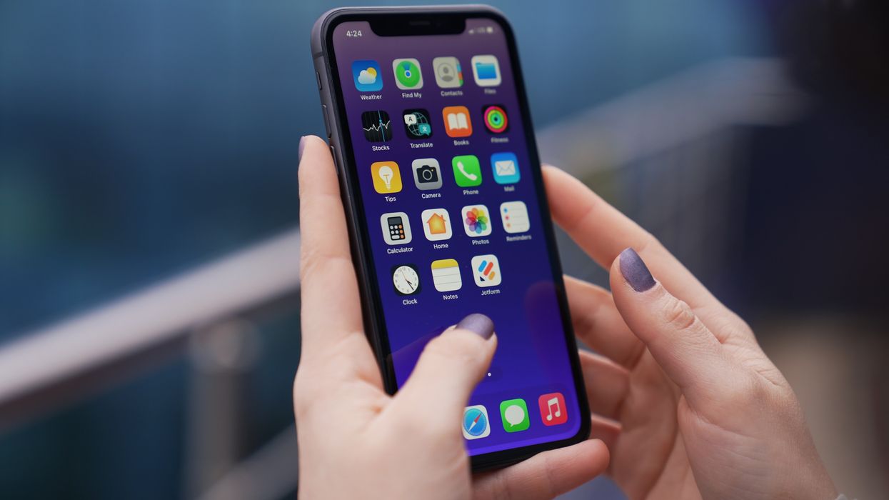 A person holding a cell phone.