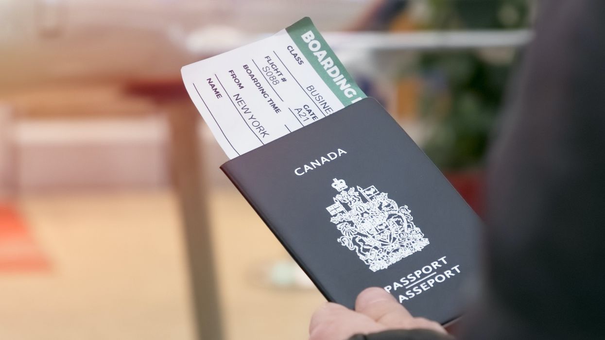 A person holds a Canadian passport.