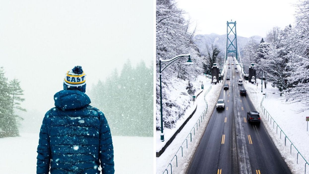 A person in a hat and parka stands outside in the snow. Vancouver's Lion's Gate Bridge is seen covered in snow.
