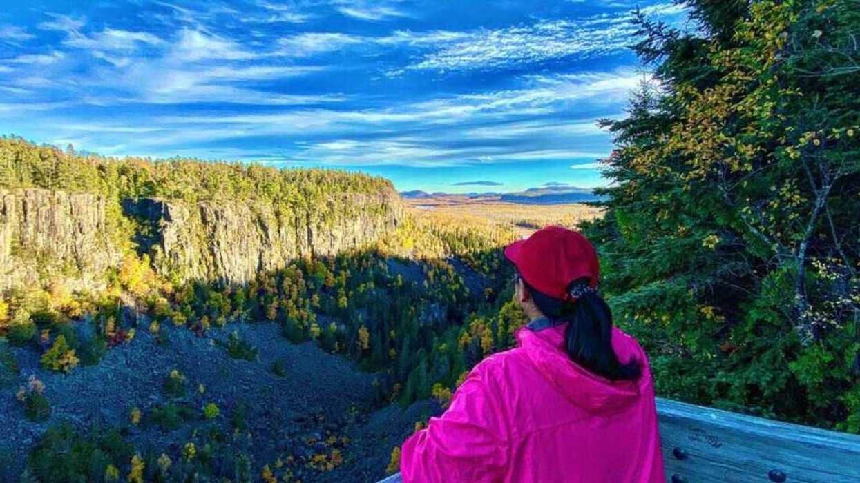 A person looking over a canyon.