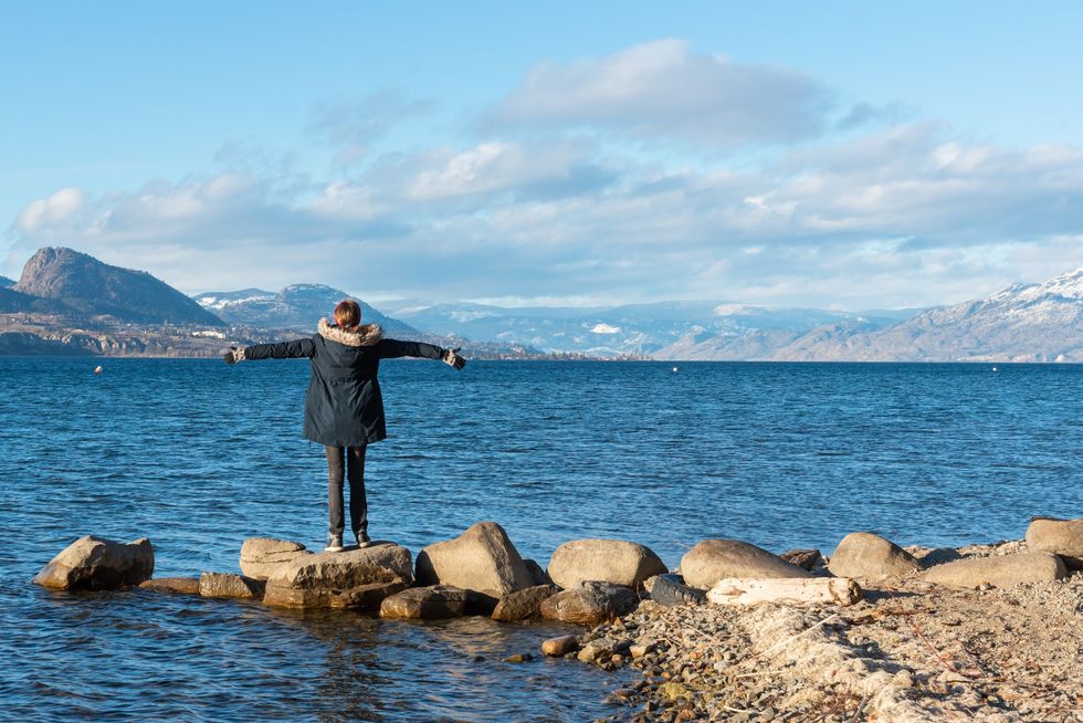 A person on the shore of Lake Okanagan, Penticton, B.C.
