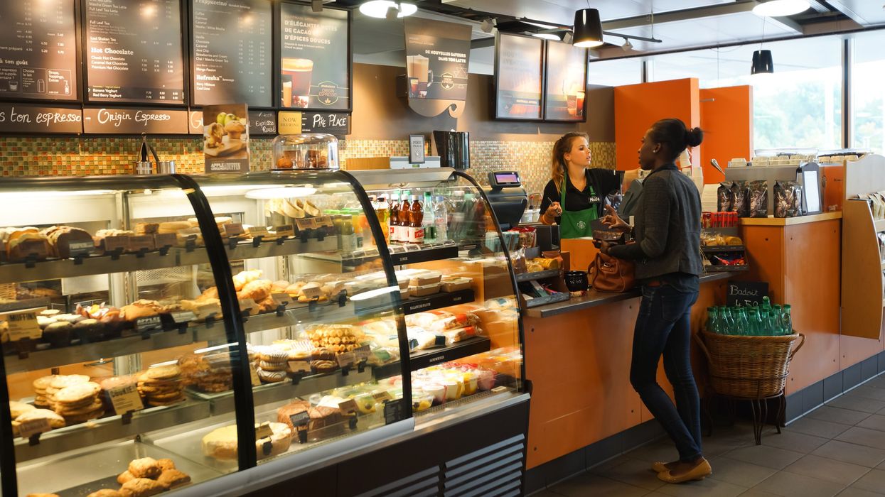 A person ordering at a Starbucks store.