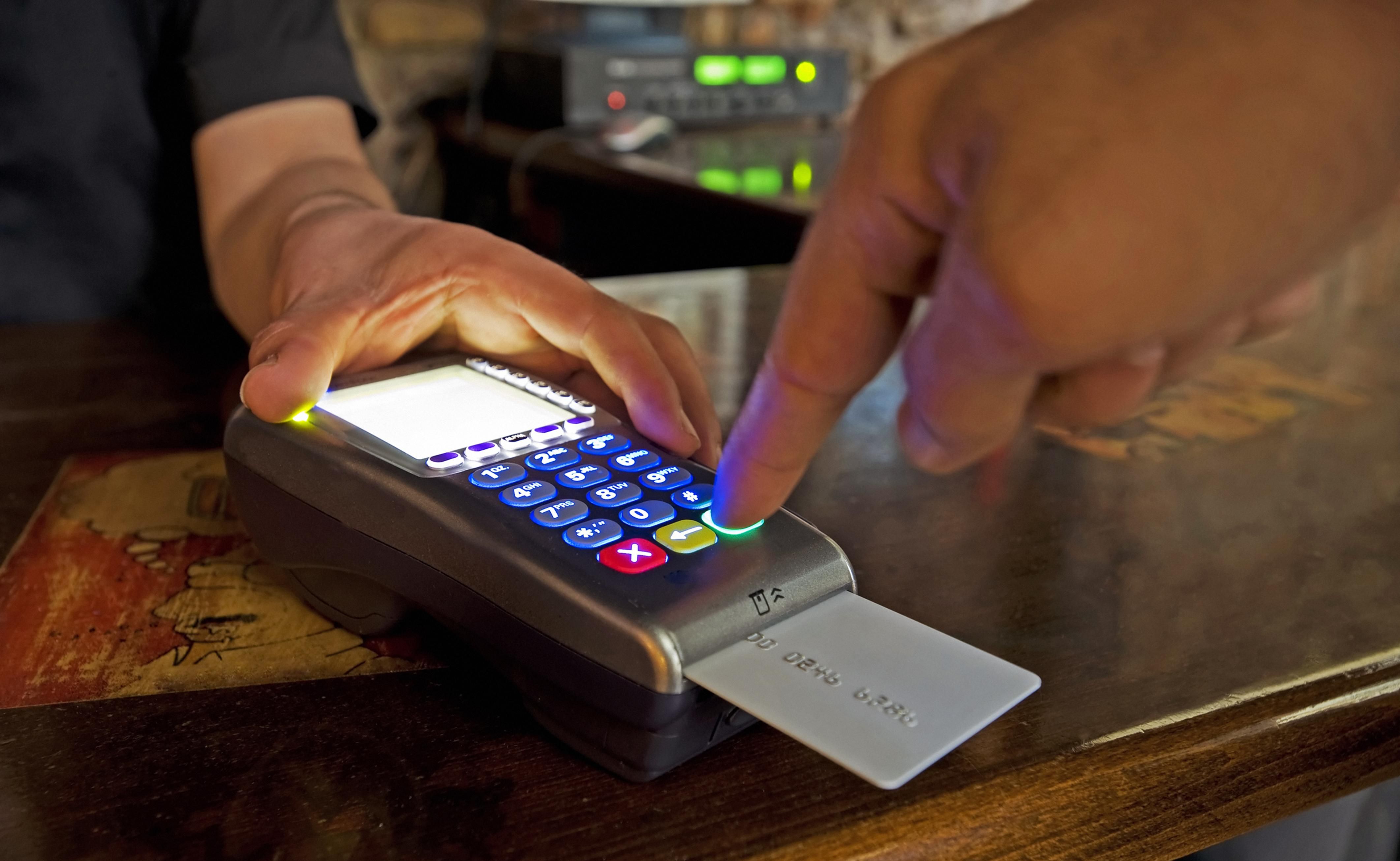A person paying at a restaurant.