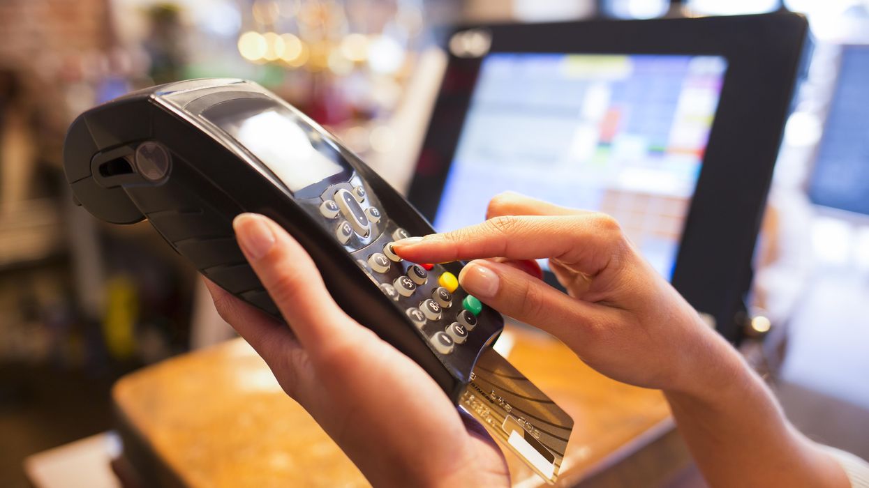 A person paying by card.