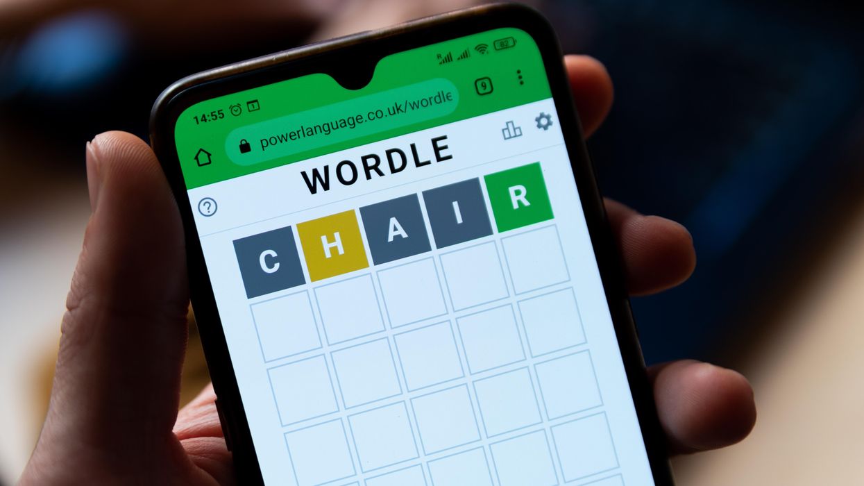 A person playing Wordle on their phone.