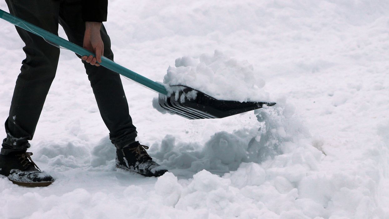 A person shovelling snow.