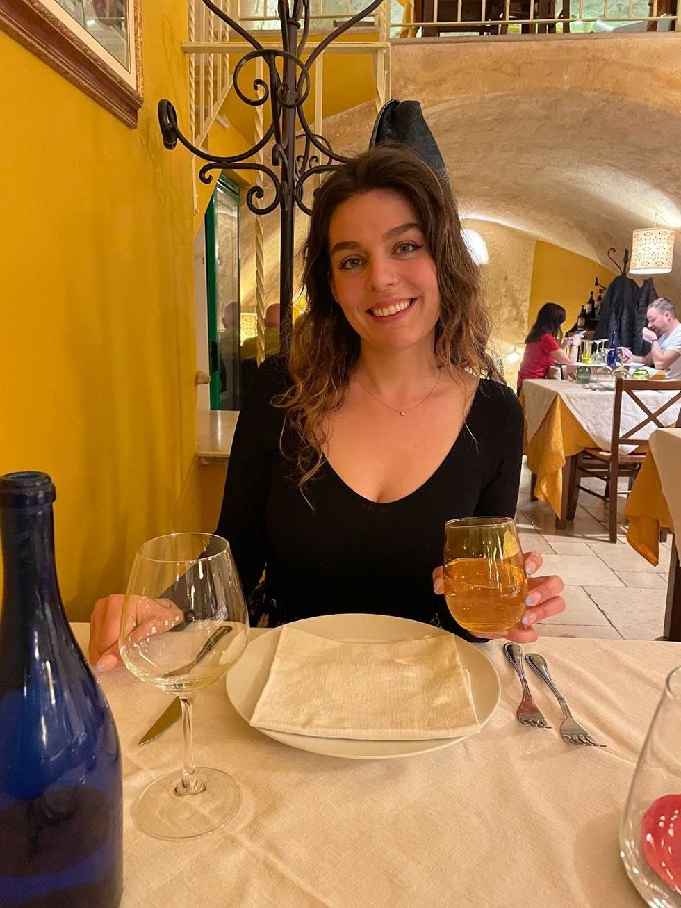 A person sitting at a table at a restaurant.
