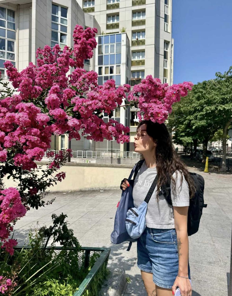 A person smelling flowers.