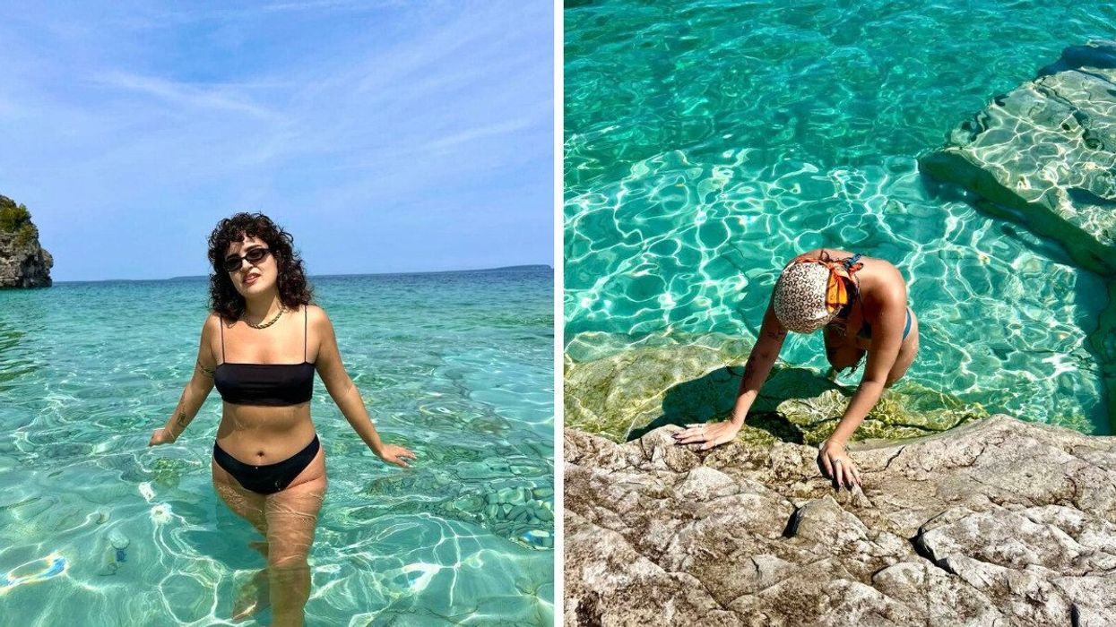 A person standing in turquoise water.