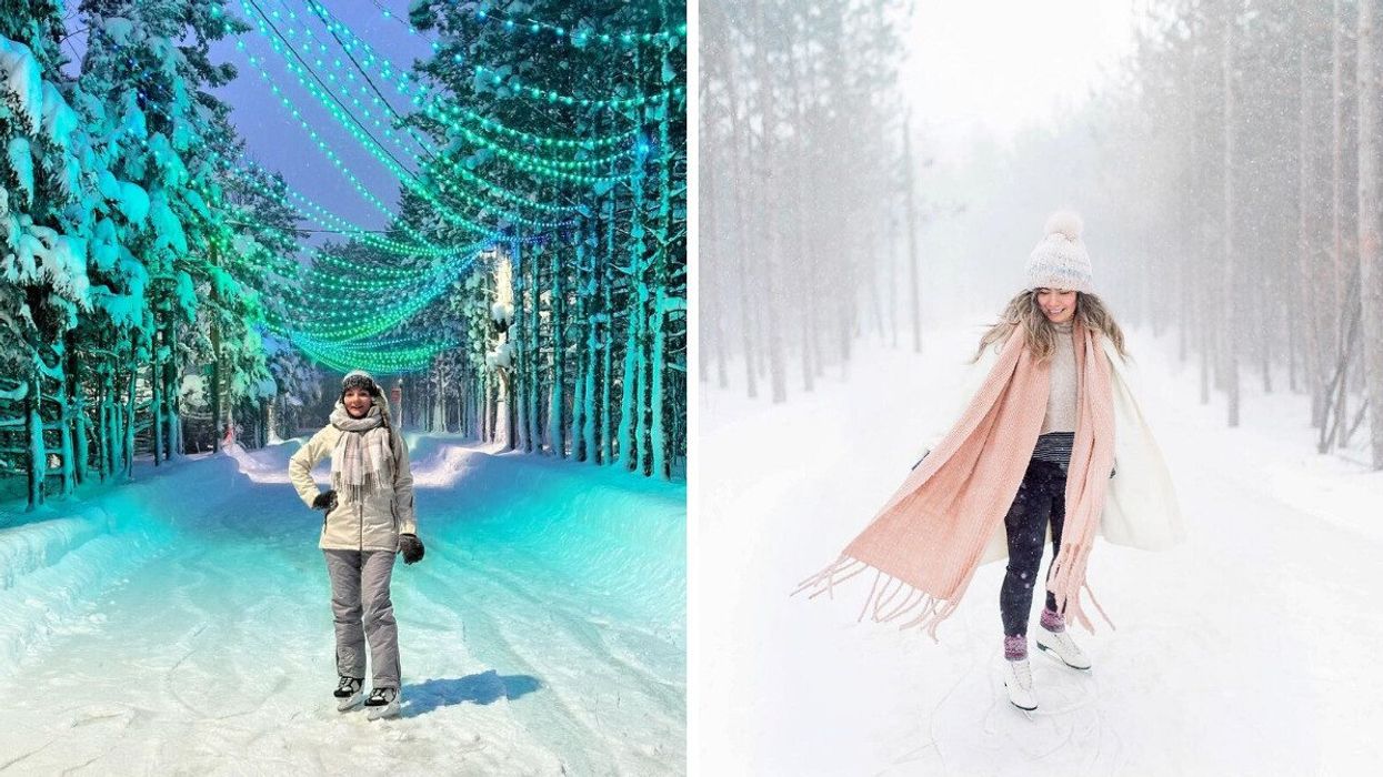 A person standing on a skating trail below a canopy of lights. A person skating.